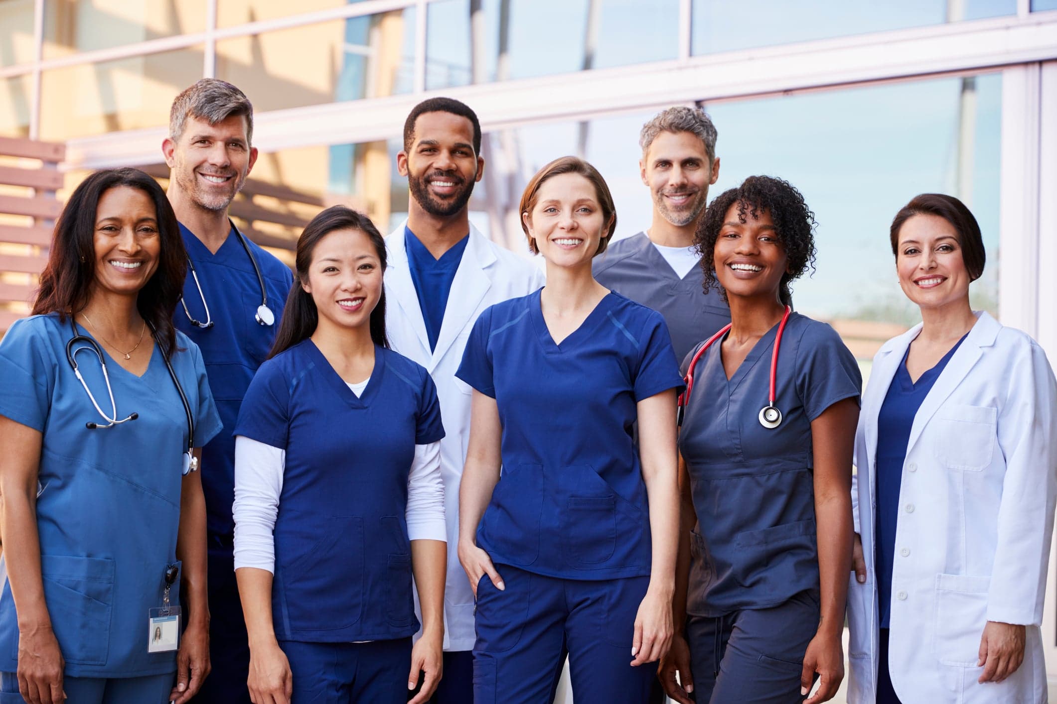 Healthcare team standing together in a hospital corridor